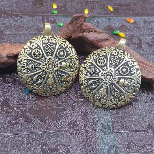 Handcrafted Tibetan Buddhist brass Bagua pendant, an ethnic jewelry art piece symbolizing luck, protection, and spiritual balance.