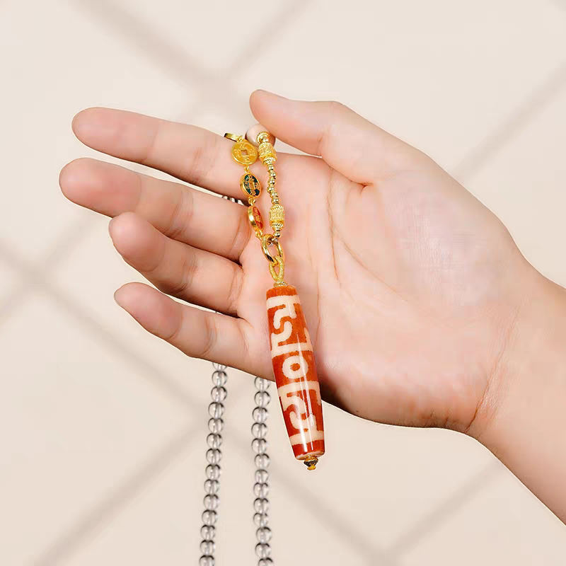  Authentic handmade red meat agate Lotus Dzi bead pendant, showcasing jewelry art and Tibetan Buddhist Jewelry Culture.