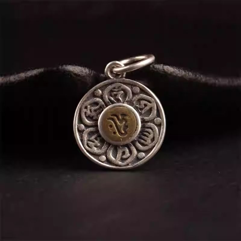 Authentic handmade silver lotus mantra accessory, showcasing jewelry art and Tibetan Buddhist Jewelry Culture.