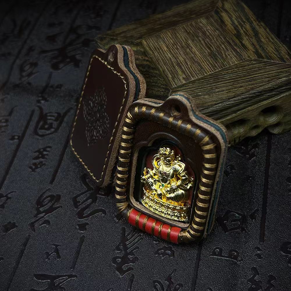 Handmade leather Thangka amulet pendant, Tibetan Buddhist jewelry art piece providing protection, spiritual balance, and good fortune.