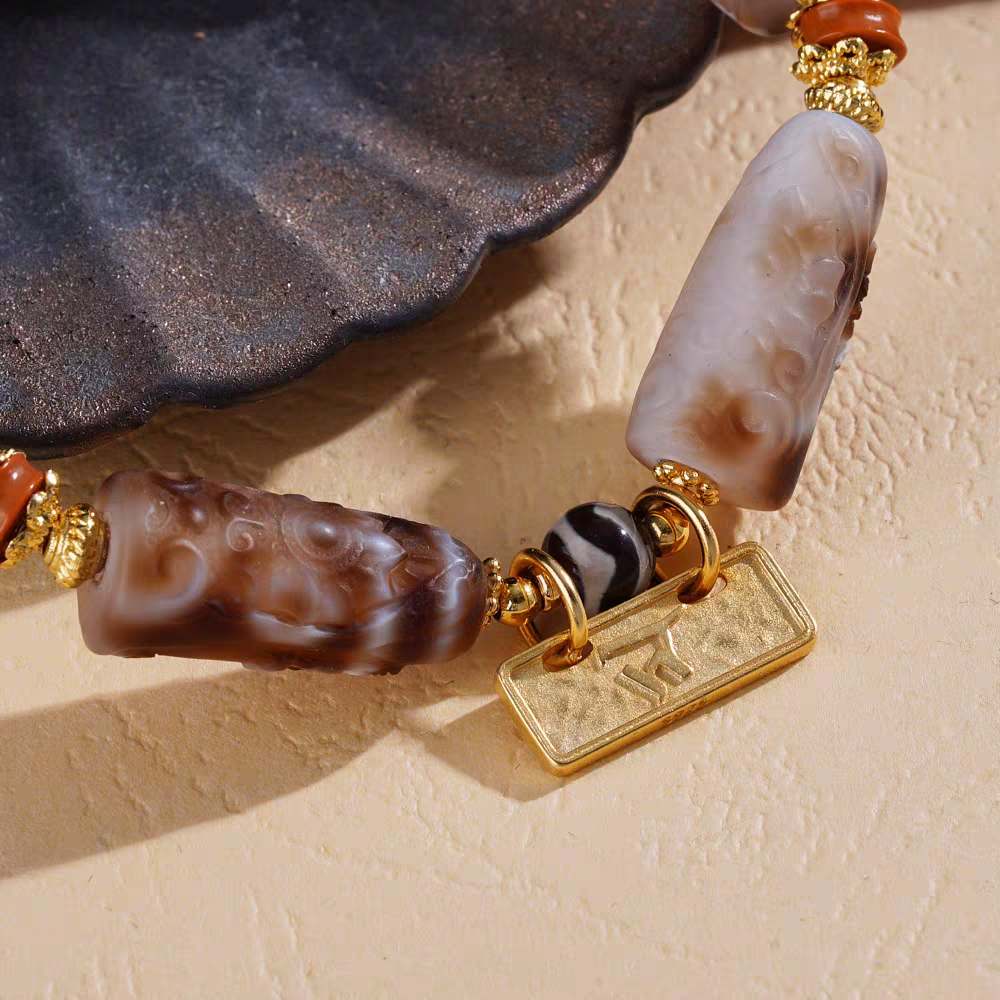 Handcrafted Tibetan Buddhist Marici Goddess carved bracelet, showcasing intricate jewelry art for spiritual and fashion purposes.
