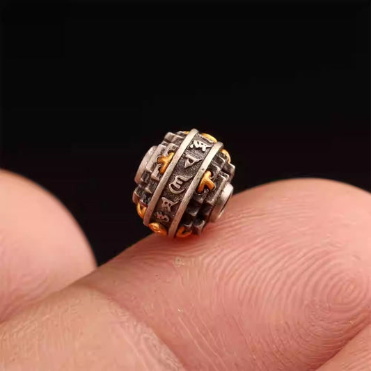 Handmade Tibetan silver and gold-plated spacer beads with mandala and six-syllable mantra, perfect for assembling spiritual bracelets and jewelry.