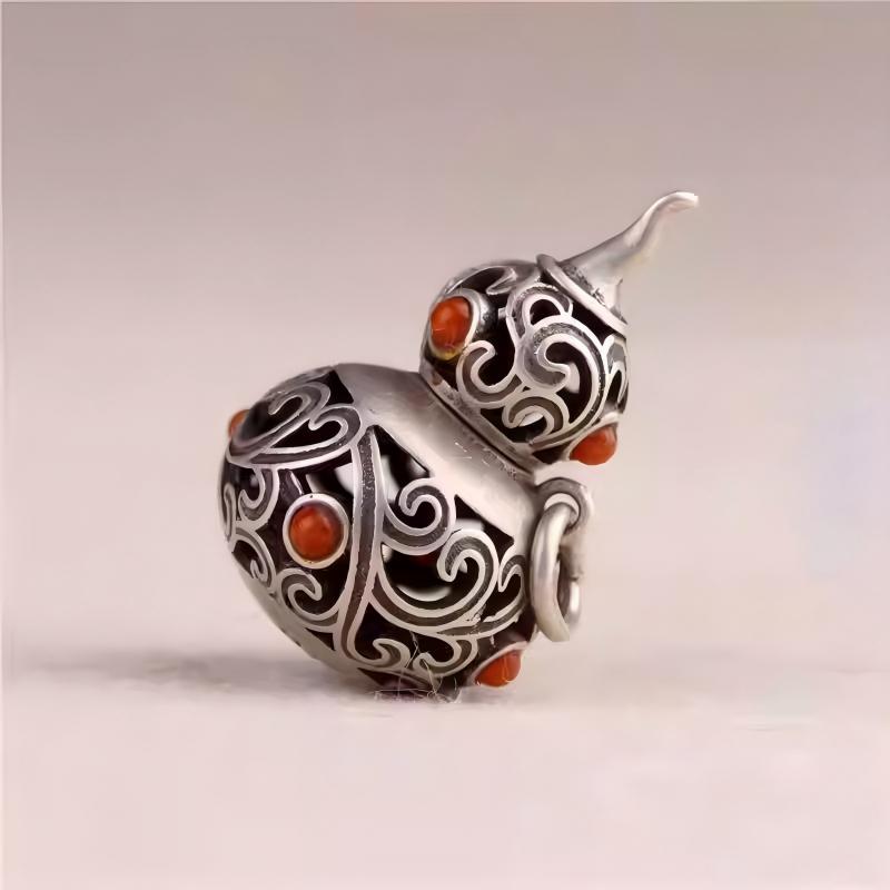Silver hollow gourd keychain pendant inspired by Tibetan Buddhist Jewelry Culture, handcrafted Jewelry art for stylish men and women.