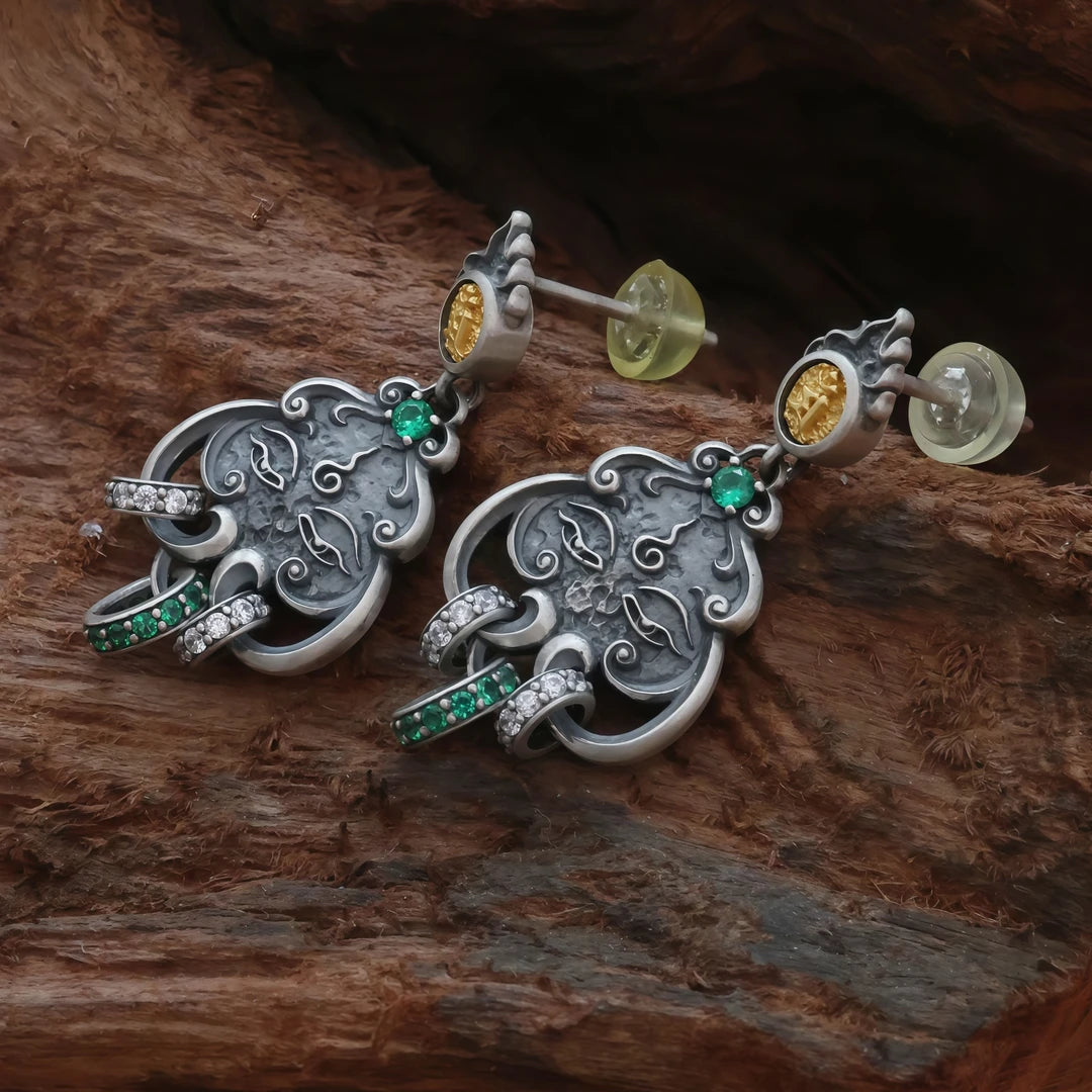 Handcrafted silver Manjushri Buddha Eye seed earrings, hand-painted to reflect Tibetan Buddhist jewelry culture and jewelry art, perfect for daily wear or meditation.