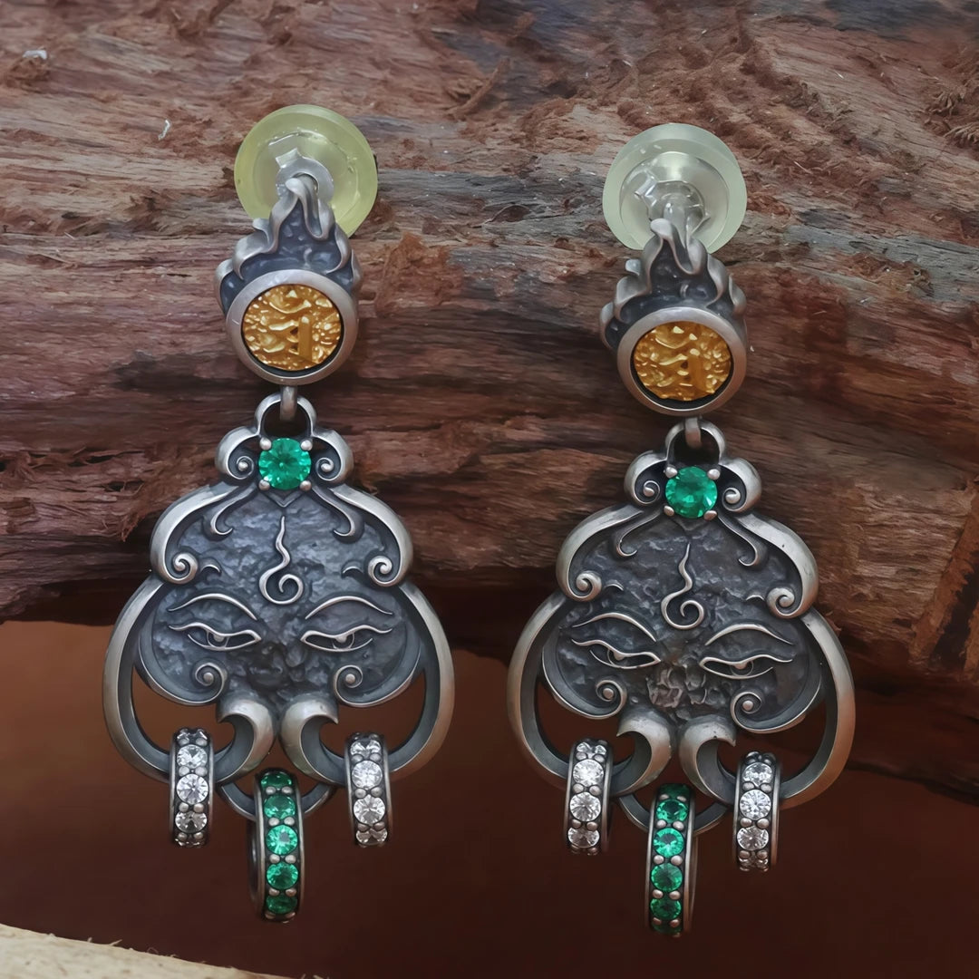 Handcrafted silver Manjushri Buddha Eye seed word earrings, inspired by Tibetan Buddhist jewelry culture and fine jewelry art, symbolizing wisdom and protection.