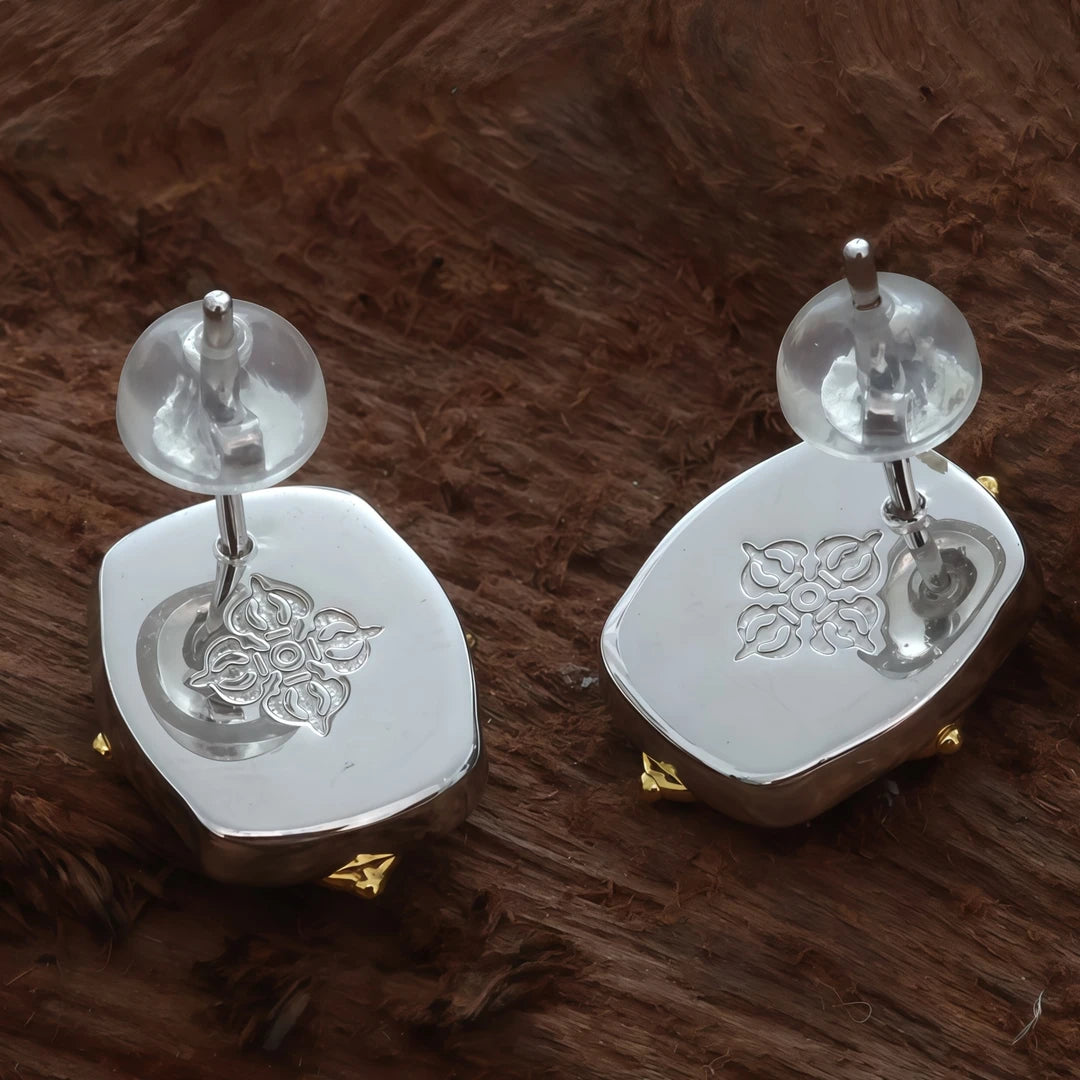 Handcrafted silver Medicine Buddha Vajra Cross earrings, designed to embody Tibetan Buddhist values of healing, protection, and spiritual insight.