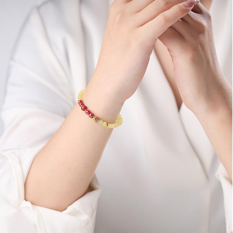 Tibetan Buddhist Jewelry Culture: Hand-Painted Amber Cinnabar Koi Time Bracelet, representing the flow of blessings through time
