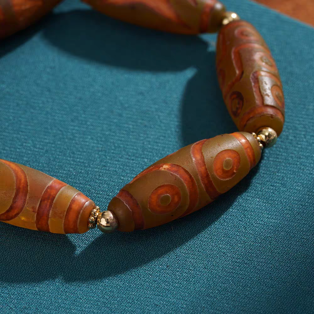 Handmade barley fire multi-treasure wrist mala, reflecting Tibetan Buddhist jewelry culture and refined jewelry art craftsmanship.
