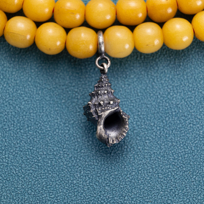 Artisan-crafted Tibetan Buddhist Jewelry Culture gold-plated conch accessory, perfect for positive energy and Jewelry art style.
