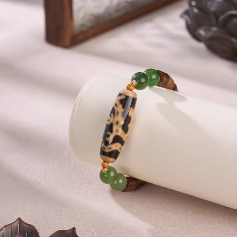 Handcrafted Dragon-riding Guanyin Dzi bracelet, inspired by Tibetan Buddhist Jewelry Culture, a spiritual jewelry art accessory for protection and fortune.