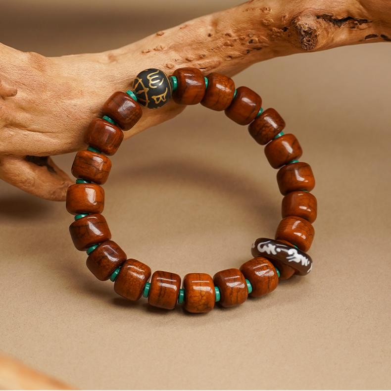 Tibetan Buddhist Jewelry Art: Hand-Painted Yak Bone and Incense Ash Barrel Bead Bracelet for spiritual protection in Tibetan tradition