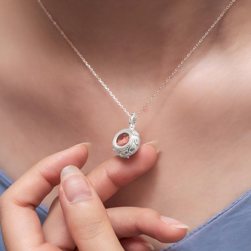 Hand-polished silver round lotus Ghau pendant, showcasing Tibetan Buddhist Jewelry Culture and artisan Jewelry art.
