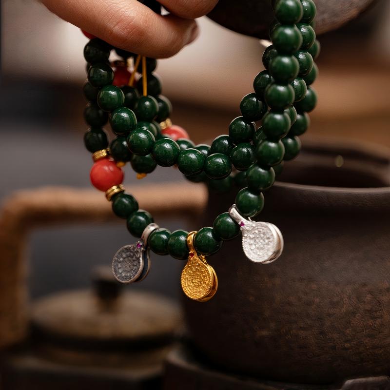 Hand-polished silver Melong amulet with Nine Palace symbols, showcasing traditional Tibetan-Buddhist Jewelry Culture.