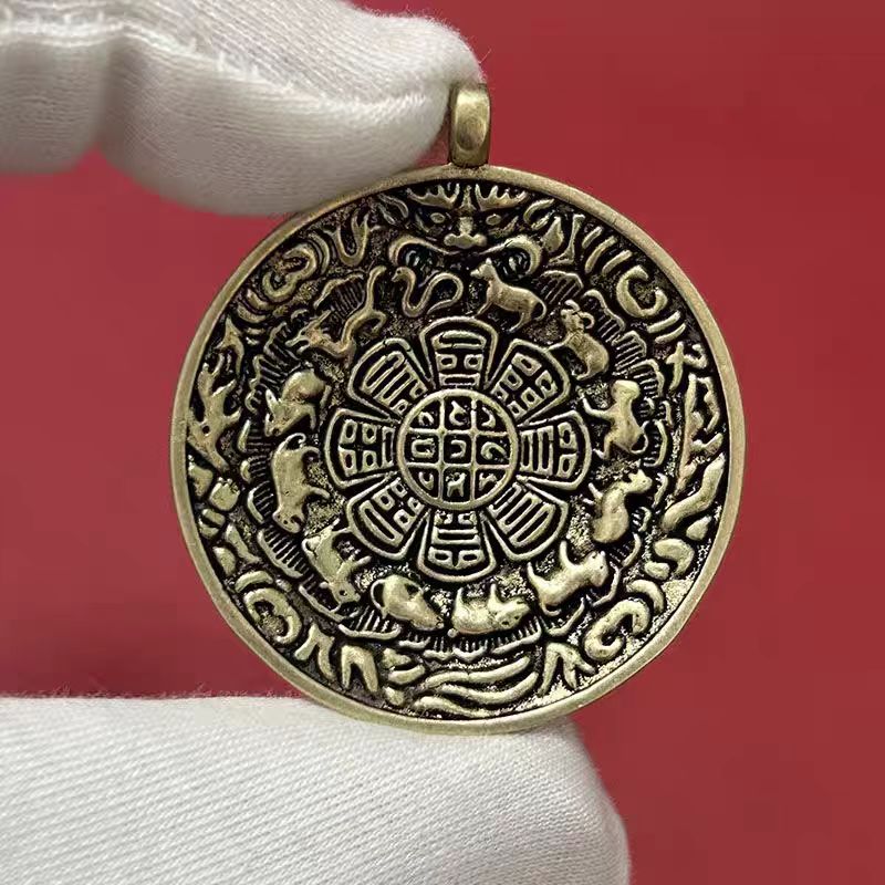Traditional Tibetan Buddhist Bagua amulet pendant in copper, handmade jewelry art for attracting fortune and spiritual protection.