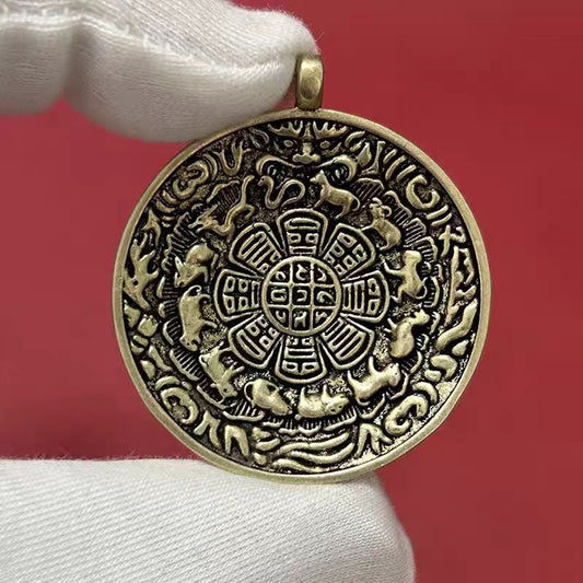 Traditional Tibetan Buddhist Bagua amulet pendant in copper, handmade jewelry art for attracting fortune and spiritual protection.
