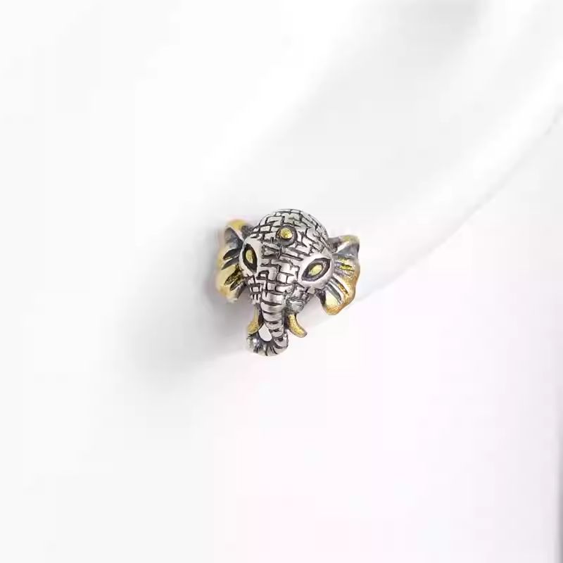 Artisan-crafted Tibetan Buddhist Jewelry Culture gold-plated elephant accessory, perfect for luck and protection Jewelry art.