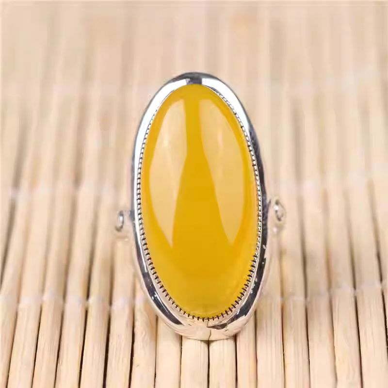  Handmade sterling silver adjustable ring inlaid with yellow chalcedony, showcasing Tibetan Buddhist Jewelry Culture and Jewelry art.
