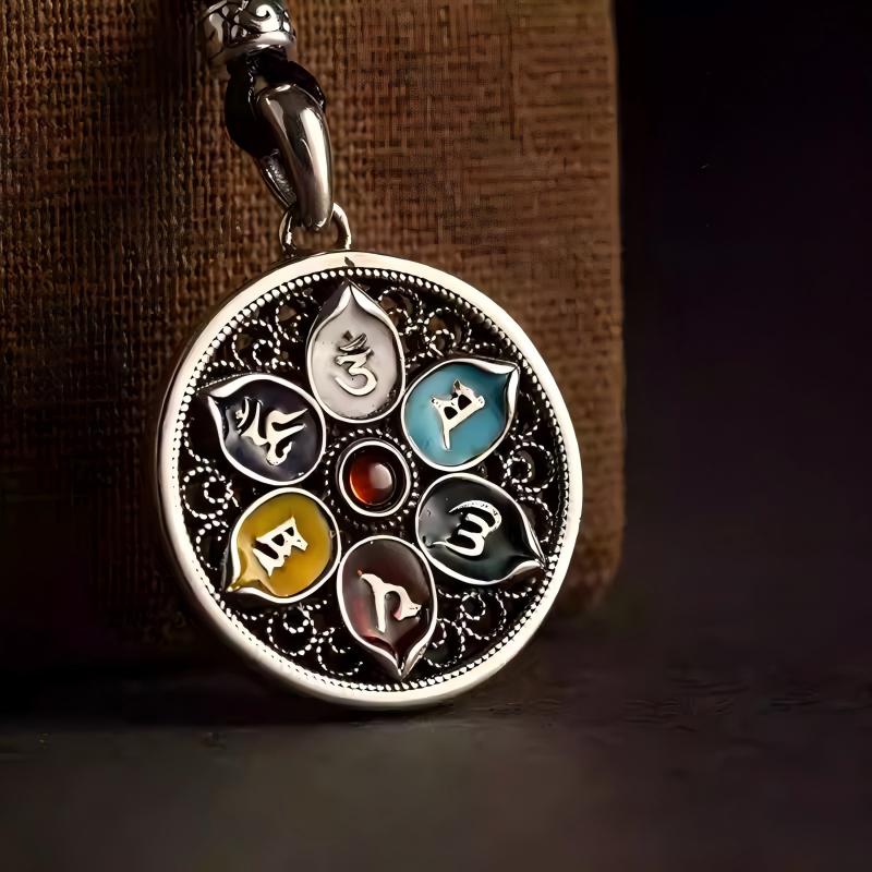 Pure silver vintage lotus mantra pendant, small and elegant, suitable for necklaces or layering, symbolizing peace, luck, and Tibetan heritage.