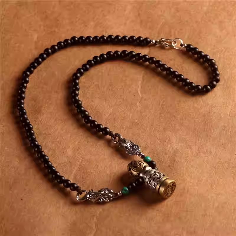 Hand-painted silver Makara pendant featuring Tibetan Buddhist Jewelry Culture motifs, perfect as a spiritual Jewelry art choker.