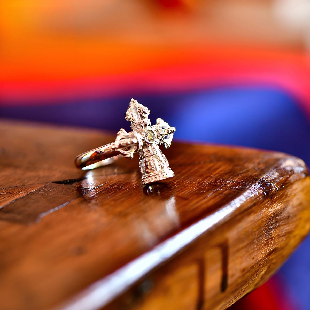 Tibetan Buddhist Jewelry Culture: Hand-carved pure silver double Vajra ring representing wisdom and compassion, peak of Buddhist jewelry art.