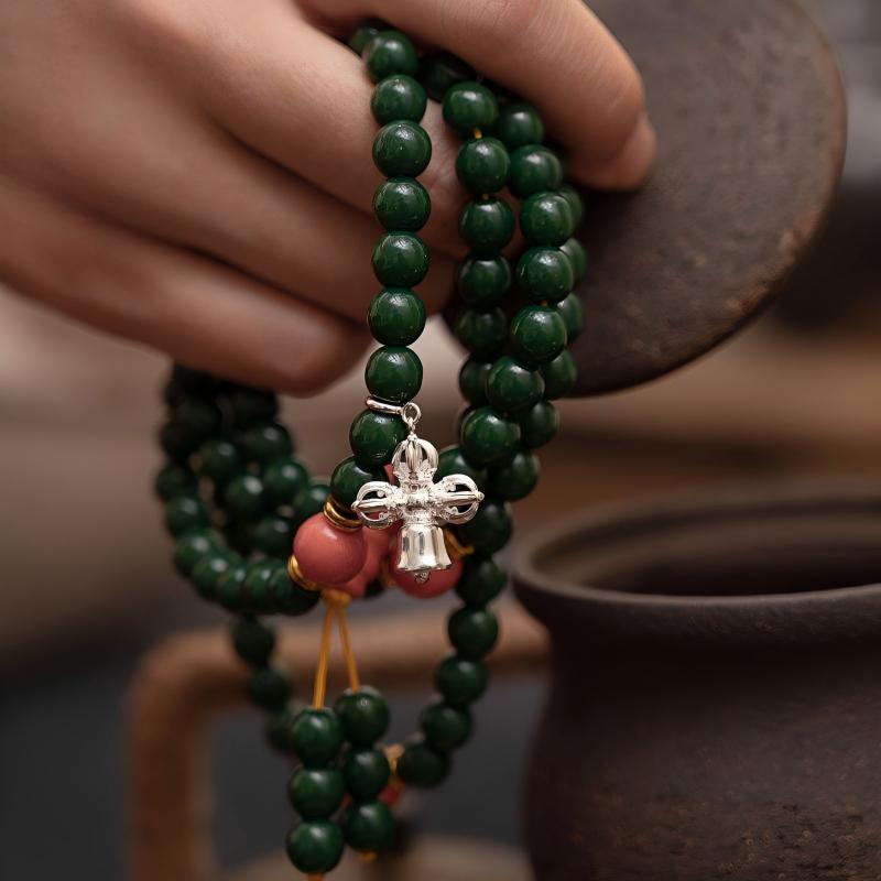 Hand-polished silver Vishvavajra (crossed dorje) amulet, showcasing traditional Tibetan-Buddhist Jewelry Culture and artisan Jewelry art.