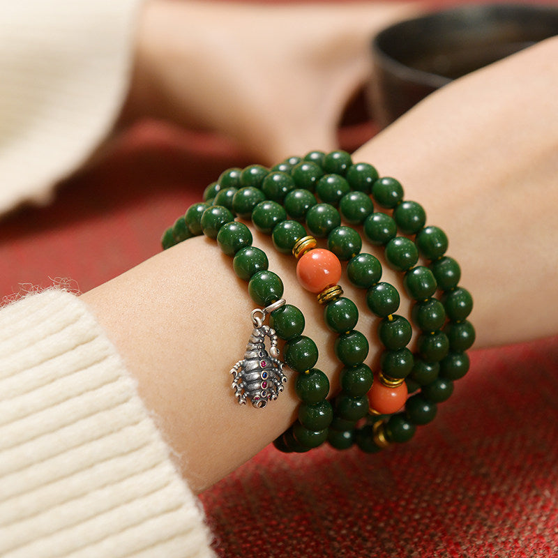 Hand-polished silver wrathful scorpion amulet, showcasing traditional Tibetan-Buddhist Jewelry Culture and artisan Jewelry art.
