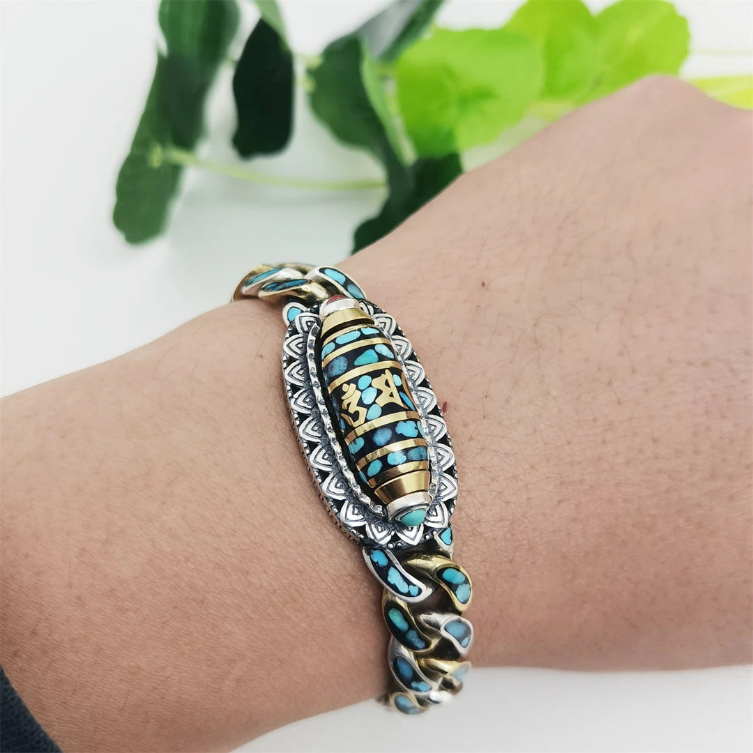 Handcrafted silver Nine Eye bracelet, symbolizing spiritual protection and Tibetan Buddhist culture, with intricate handmade designs for a unique jewelry piece.