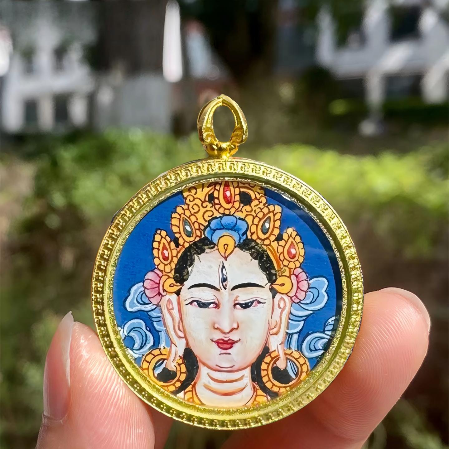 Hand-painted Tibetan Buddhist White Tara pendant with small Thangka in Gau box, handcrafted jewelry art offering protection, compassion, and spiritual blessings.