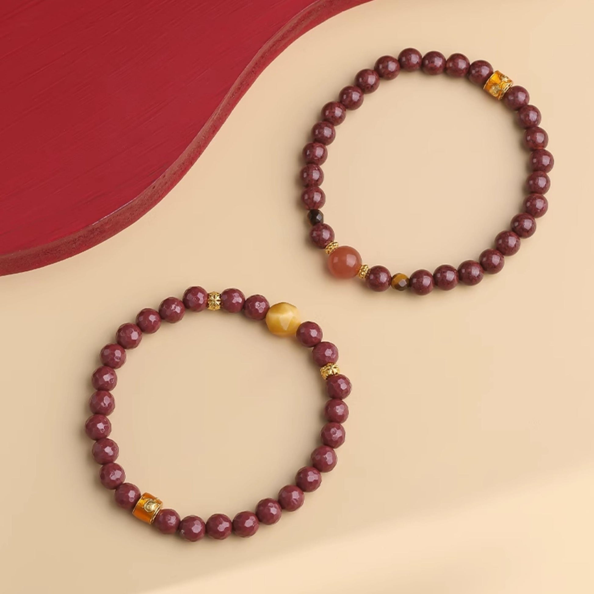 Empowering Tibetan Buddhist Blessing Bracelet, combining hand-painted Cinnabar with potent Tiger Eye for inner power and determined action.