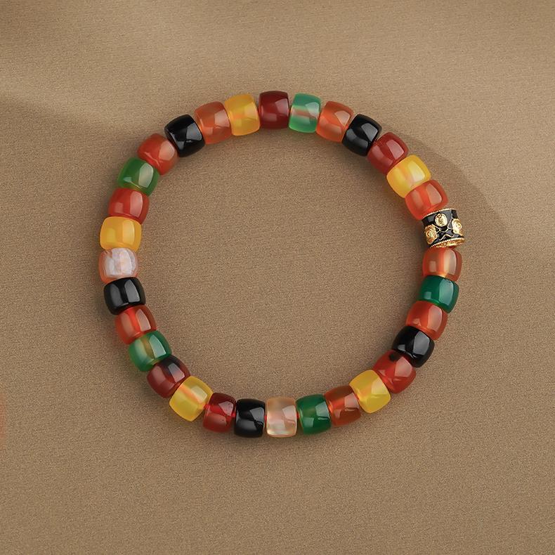 Hand-Painted Dark Agate Wealth God Mala Bracelet, a powerful piece of Tibetan Buddhist Jewelry Culture for attracting fortune.