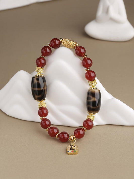 Tibetan Buddhist Jewelry Art: Hand-Painted Red Agate Dzi Beads Bracelet for spiritual growth and positive energy in Tibetan Buddhist tradition
