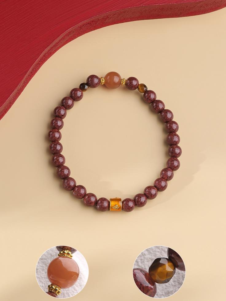 Tibetan Buddhist Spiritual Guardian Bracelet, featuring protective Cinnabar and grounding Tiger Eye beads, crafted for energy shielding and strength.