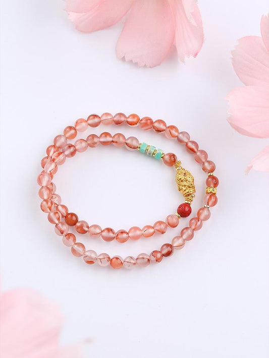 Tibetan Buddhist Jewelry Culture: Handmade Cinnabar Glass Multi-Circle Red Bracelet combining protective energy with vibrant spiritual practice