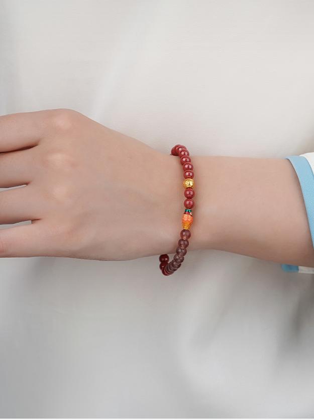 Tibetan Buddhist Jewelry Art: Cinnabar Strawberry Quartz Beads Protection Bracelet warding off negative energy while attracting love