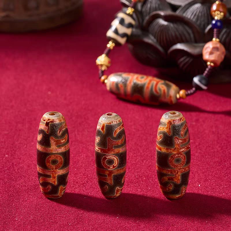 Handcrafted jewelry art necklace featuring sacred Lotus Dzi with barley grain motifs, representing abundance and wisdom.