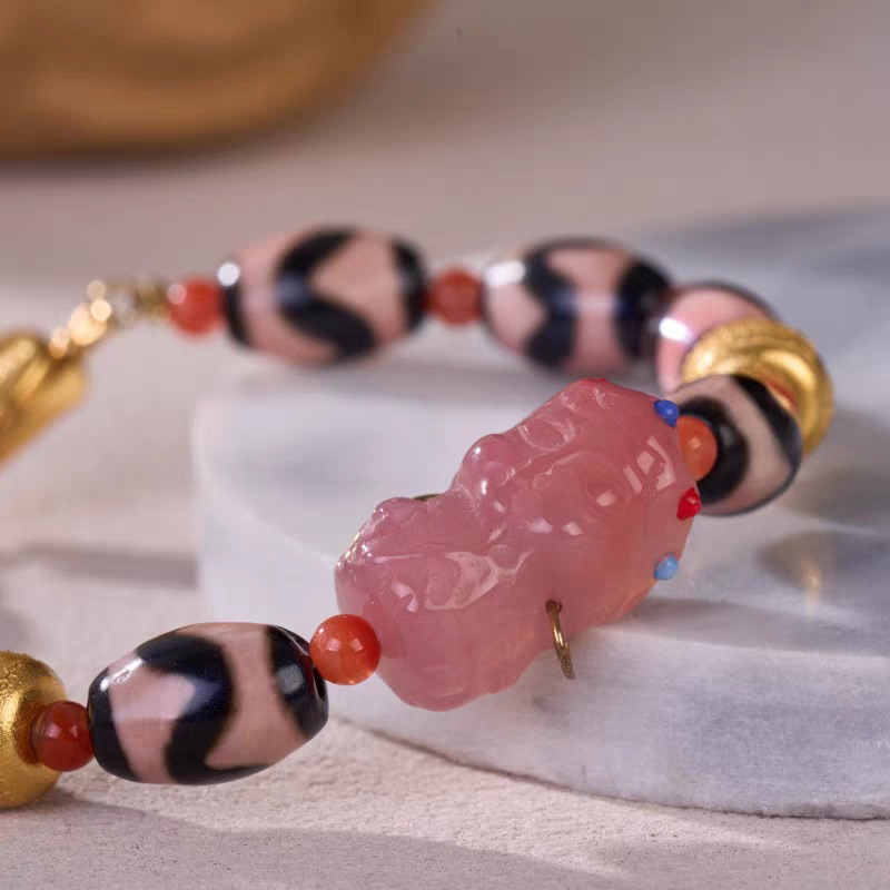 Handcrafted jewelry art bracelet featuring sacred Green Tara motif, representing swift action and success in Tibetan Buddhist traditions.