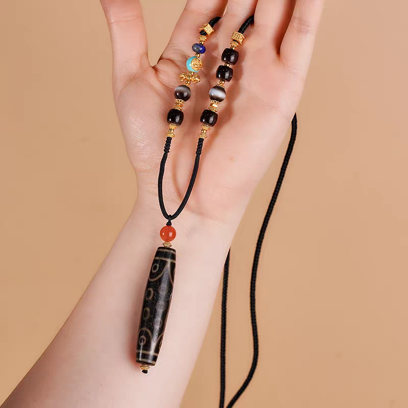 Exquisite 21-eyed natural agate Dzi jewelry, a rare artifact rooted in Tibetan Buddhist Jewelry Culture.