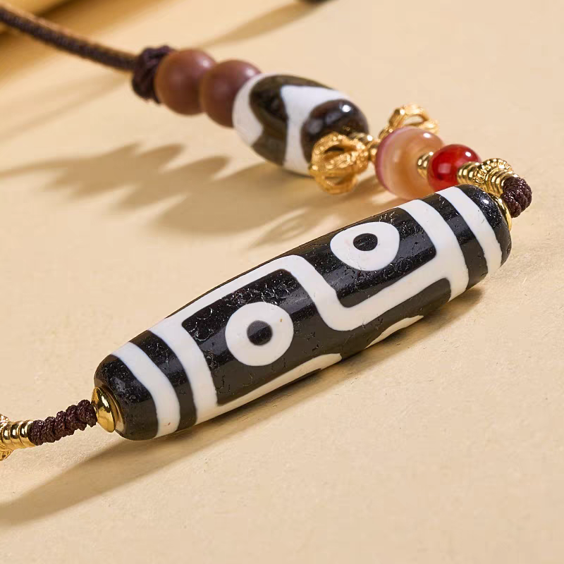  Handcrafted jewelry art clavicle necklace featuring a sacred six-eye Dzi, representing the six perfections in Tibetan traditions.