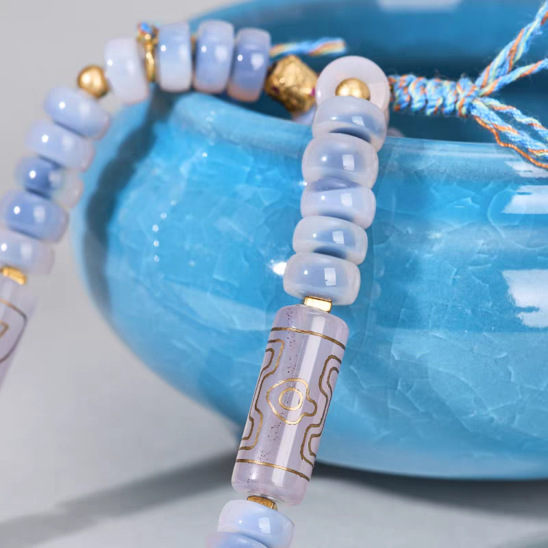 Handcrafted jewelry art necklace featuring sugar heart agate beads, representing the fusion of traditional craft and Tibetan Buddhist Jewelry Culture.