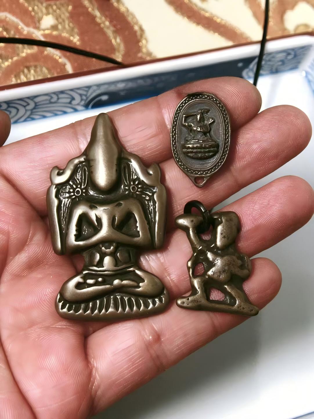 Alt text: This Lima copper statue of four-armed Guanyin with a Vajra hand and Manjusri Buddha symbolizes enlightenment and wisdom. A beautiful handmade piece of Tibetan Buddhist jewelry art.
