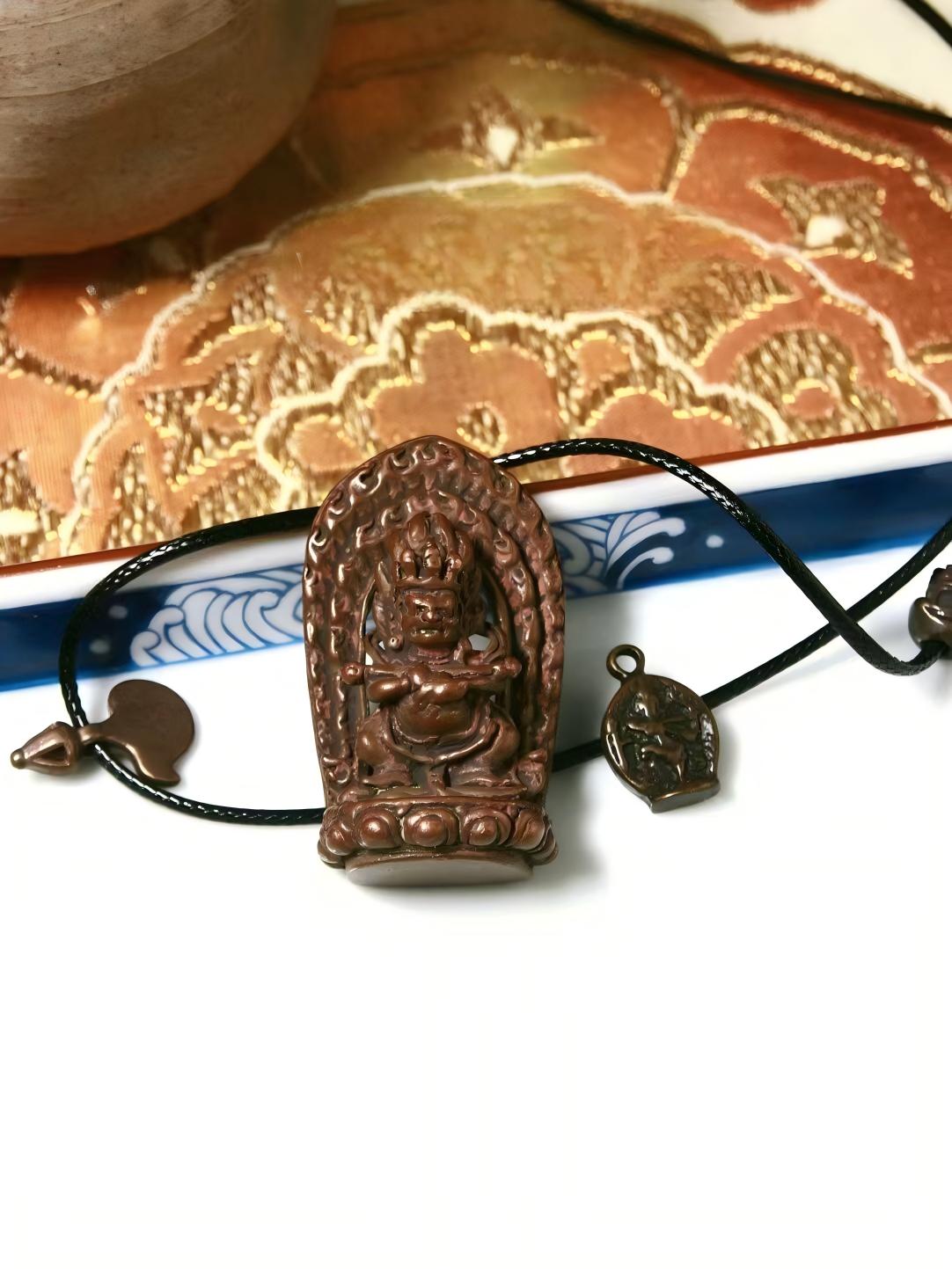 Mahakala bronze figure with Baogang Huozhu and red staff, embodying Tibetan Buddhist Jewelry Culture, featuring hand-painted details and spiritual protective energy