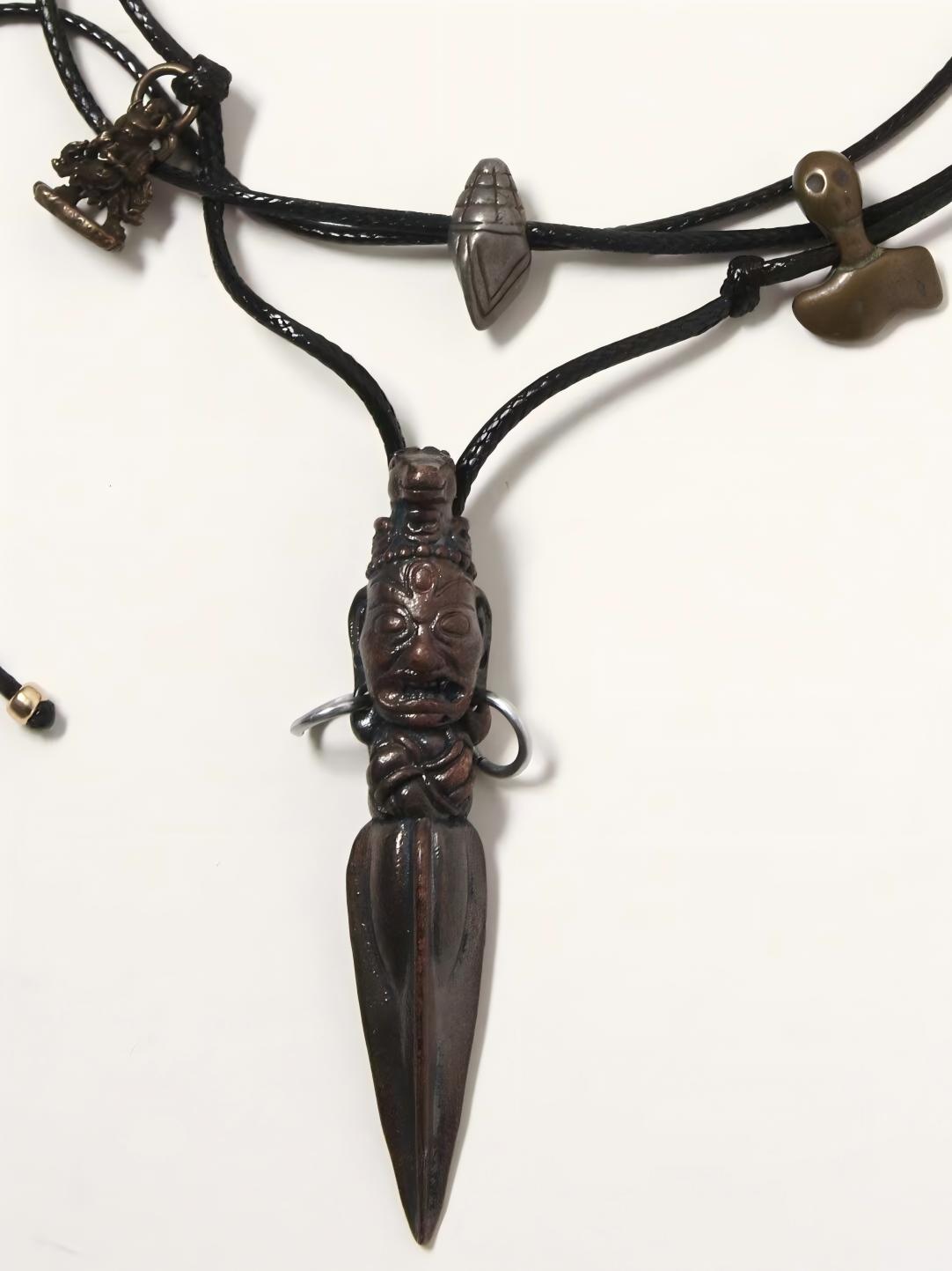 Cross Pubha Vajra woven accessory, combining strength and protection in Tibetan Buddhist Jewelry, handcrafted with traditional techniques.