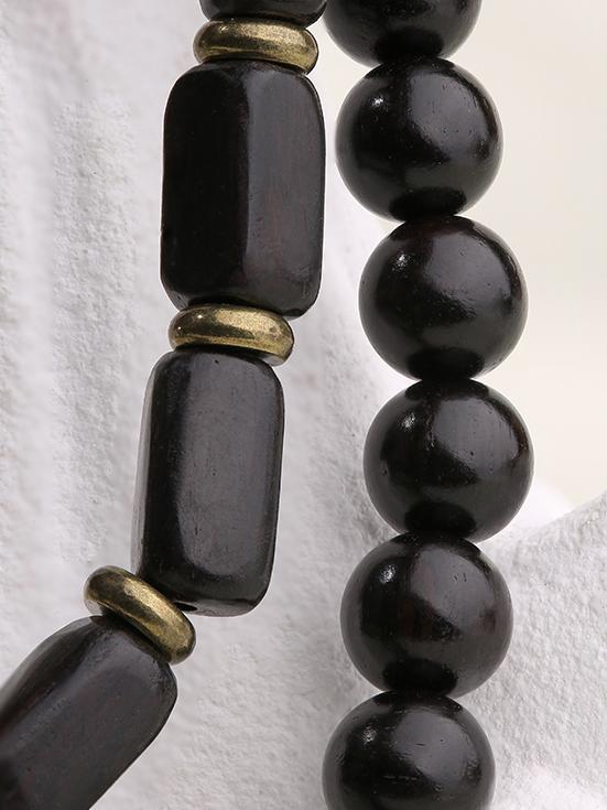 A Choyun Ye Sandalwood bracelet for inner peace, an exceptional piece of handcrafted art that stands out in jewelry.