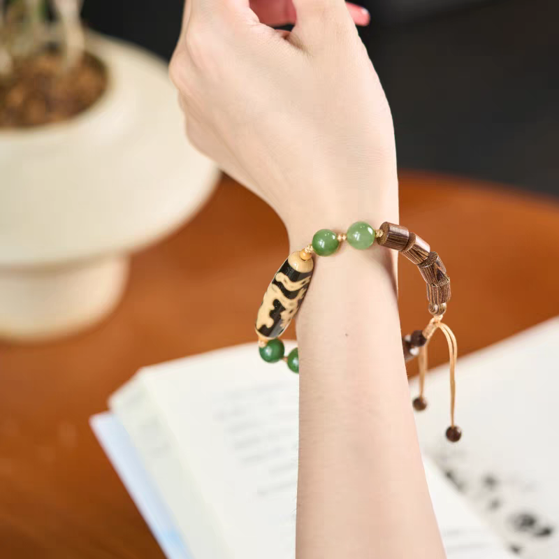 Handmade agate Dzi bead bracelet featuring Guanyin riding Dragon, Tibetan Buddhist Jewelry Culture-inspired jewelry art, a lucky and protective bracelet.