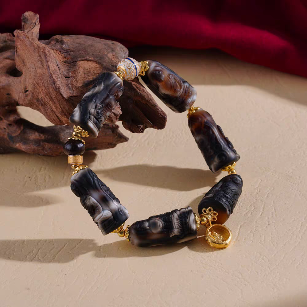 F Carved Medicine Beads Dzi bracelet, handcrafted in Tibetan Buddhist jewelry culture, providing protection, luck, and exquisite jewelry art.