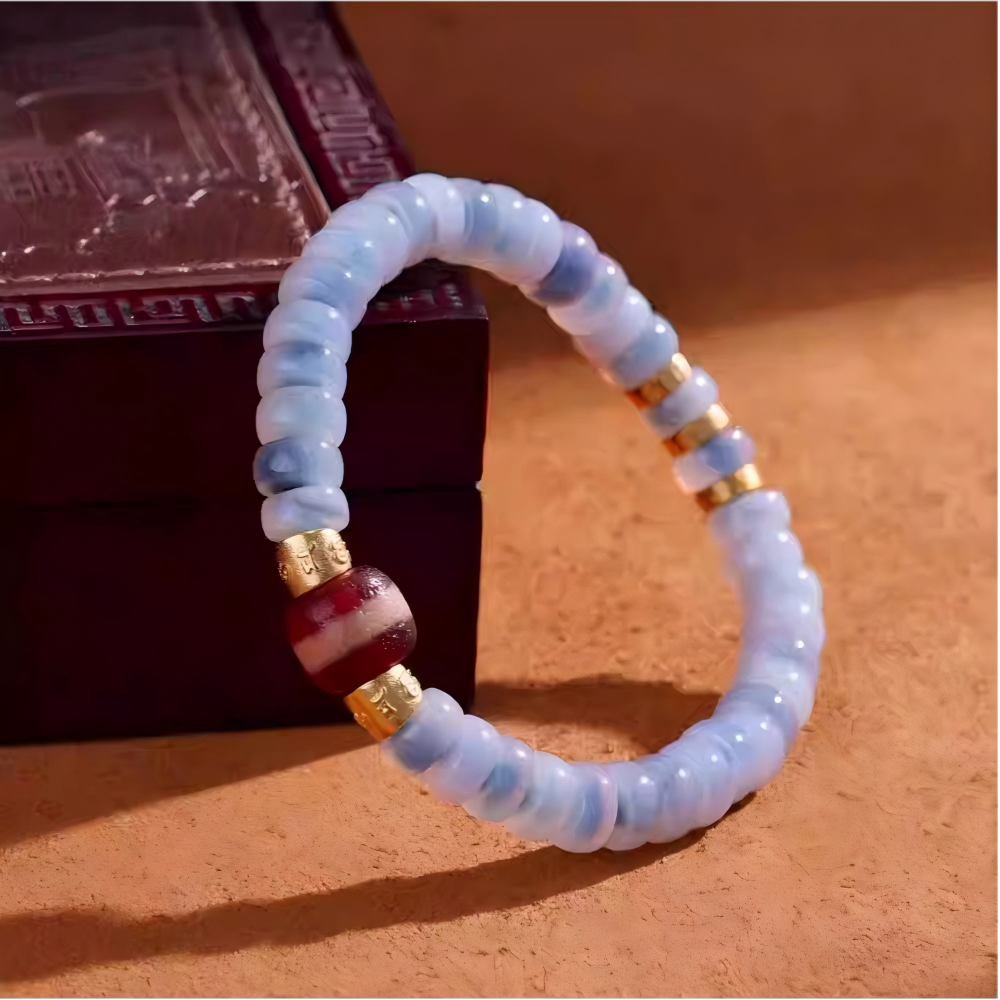 Authentic natural red meat agate Medicine Dzi with hand-painted details, showcasing the fusion of Tibetan Buddhist Jewelry Culture and modern jewelry art.