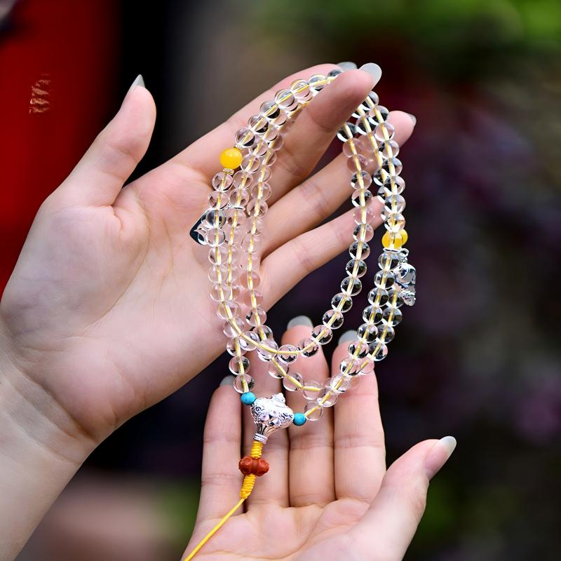 Tibetan Buddhist Jewelry Culture: Hand-knotted white crystal 108 japa mala for meditation, representing the pinnacle of Buddhist sacrificial items art.
