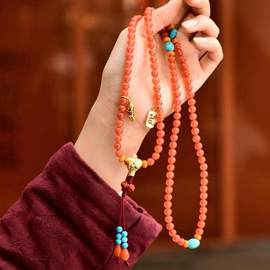 Tibetan Buddhist Jewelry Culture: Traditional cherry red agate necklace, reflecting elegant Buddhist jewelry art and spiritual protection.