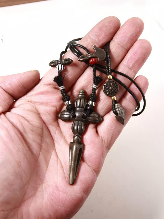 Hand-carved Dorje Pubha Vajra sculpture, representing Tibetan Buddhist Jewelry Culture, meticulously crafted to embody spiritual protection and energy.