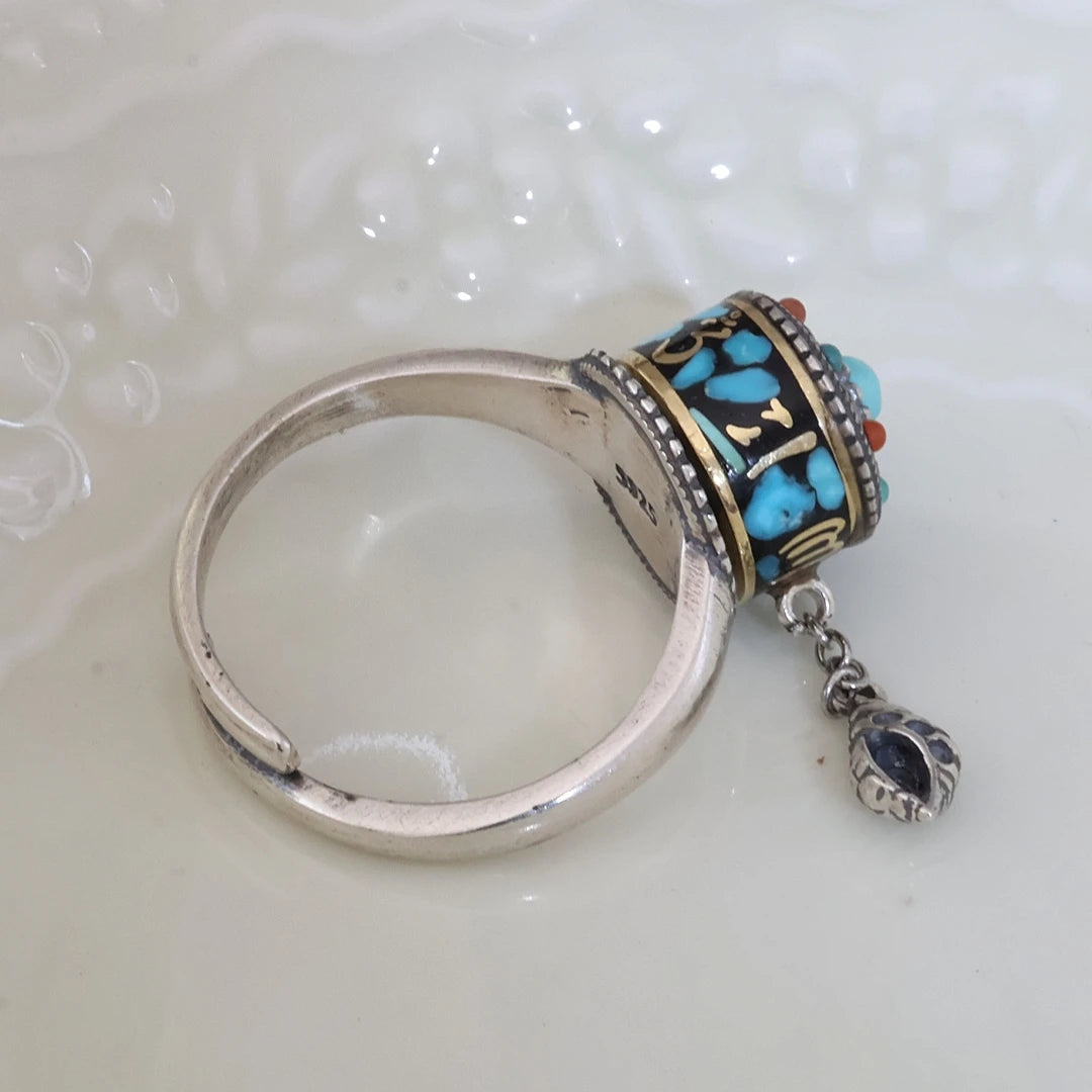 Spiritual blue mantra ring with hand-painted details, a unique piece of Tibetan Buddhist Jewelry Culture jewelry art for 2026.